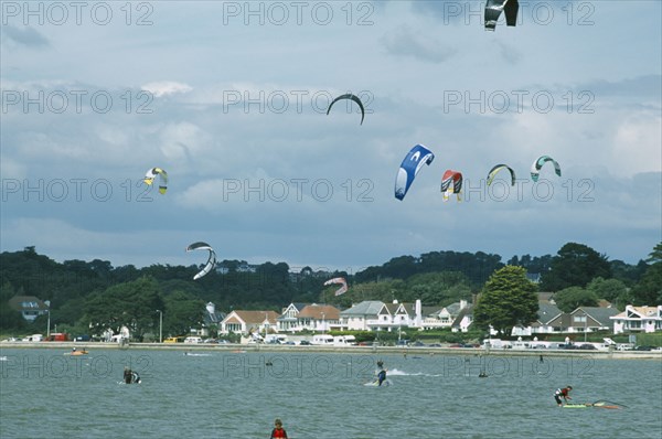 ENGLAND, Dorset, Sandbanks, Poole Harbour. Kite Surfing