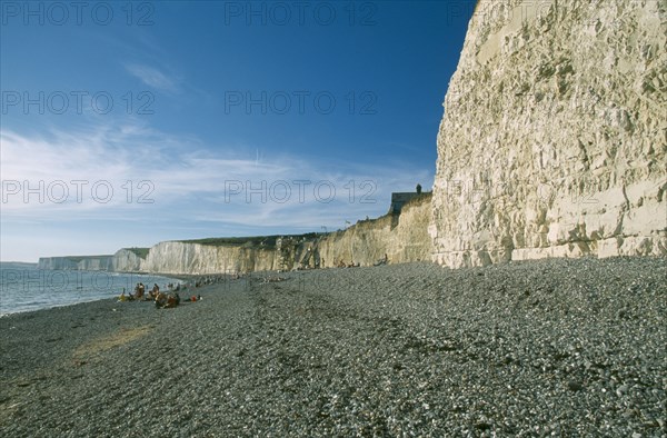ENGLAND, East Sussex, Birling Gap, Peeble beach and a long section of cliff face.