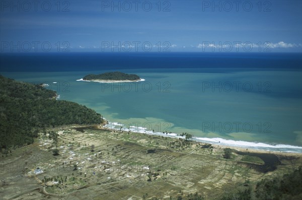 INDONESIA, Tsunami, Aceh Province, "Aerial shot looking down on flooded Aceh coastline and destroyed town, 5 months after December 2004."