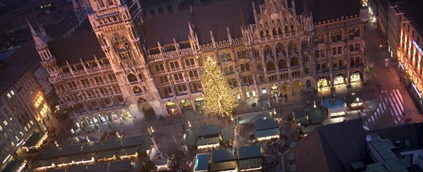 GERMANY, Bavaria, Munich, Panoramic view of the Christmas Market beneath the Rathaus.