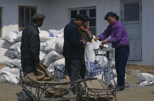NORTH KOREA, N. Pyongan Province, Uiju County, WFP rice distribution to farmers affected by flooding.