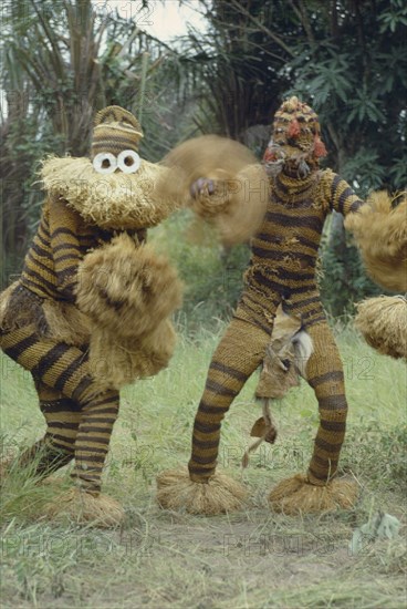 CONGO, Tribal Peoples, Bapende tribe animal masqueraders performing dance at initiation ceremony.