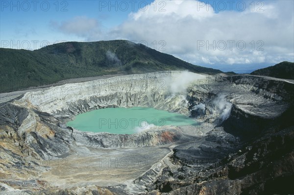 COSTA RICA, Alajuela Province, Poas Volcano, Volcan Poas National Park. View over crater into lake.