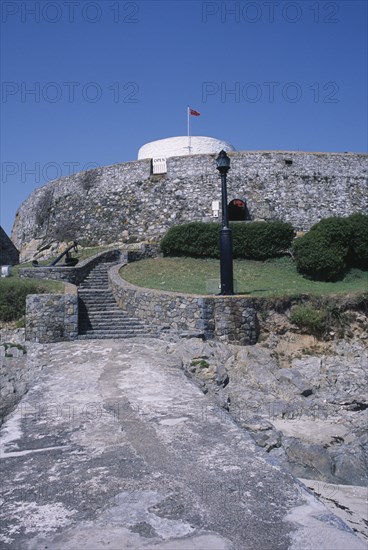 UNITED KINGDOM, Channel Islands, Guernsey, St Peters. Fort Grey Martello Tower and Shipwreck Museum. Also known as the Chateau de Rocquaine or the Cup and Saucer.