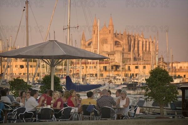 SPAIN, Balearic Islands, Mallorca, "Palma de Mallorca, Cafe next to the port with the Cathedral behind."