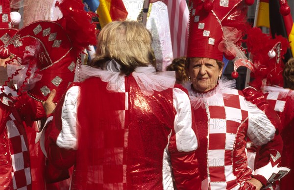 CROATIA, Kvarner, Rijeka, "Mask carnival women in jesters' costumes. The streets of Rijeka are a riot of colour as the city celebrates the end of winter carnival, held on the last Sunday before Ash Wednesday"