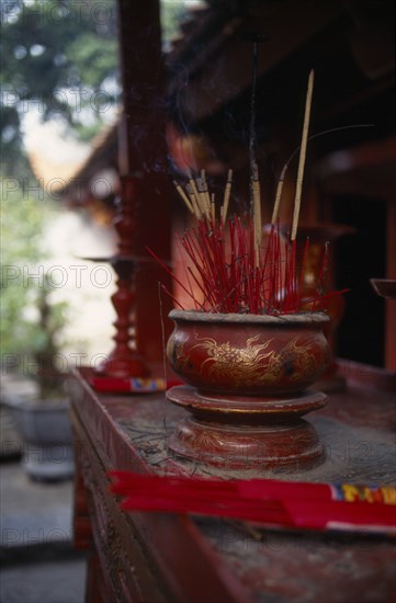 VIETNAM, North, Hanoi, Temple of Literature founded in 1070 by Emperor Ly Thanh Tong and dedicated to Confucius.  Interior detail of altar with bowl of burning incense.