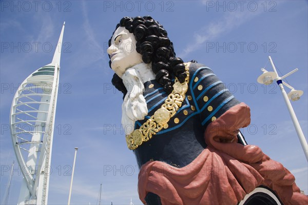 ENGLAND, Hampshire, Portsmouth, The Spinnaker Tower the tallest public viewing platforn in the UK at 170 metres on Gunwharf Quay with old ships bowspit figurehead in the foreground