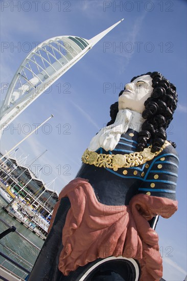 ENGLAND, Hampshire, Portsmouth, The Spinnaker Tower the tallest public viewing platforn in the UK at 170 metres on Gunwharf Quay with old ships bowspit figurehead in the foreground