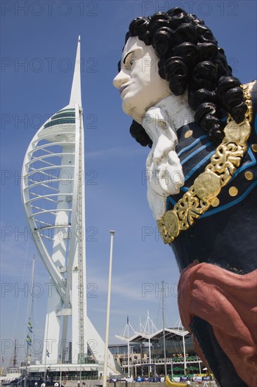 ENGLAND, Hampshire, Portsmouth, The Spinnaker Tower the tallest public viewing platforn in the UK at 170 metres on Gunwharf Quay with old ships bowspit figurehead in the foreground