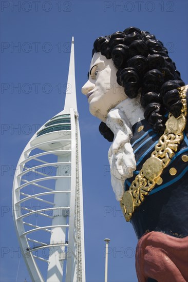 ENGLAND, Hampshire, Portsmouth, The Spinnaker Tower the tallest public viewing platforn in the UK at 170 metres on Gunwharf Quay with old ships bowspit figurehead in the foreground