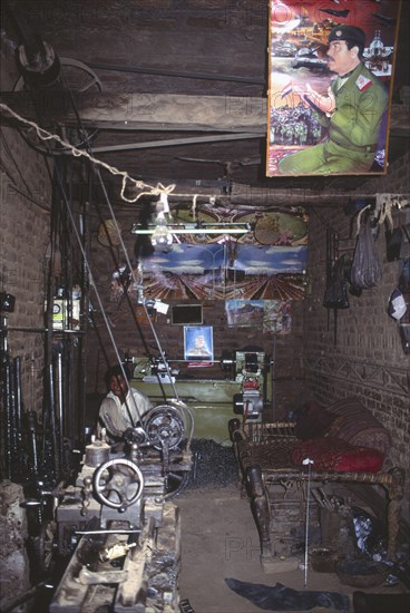 PAKISTAN, North West Frontier Province, Peshawar, "Weapon manufacturing workshop, as well as posters of Saddam Hussein."