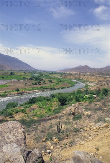 PERU, Northern, River and flood plain in background on road from Cajamarca to Chiclayo.