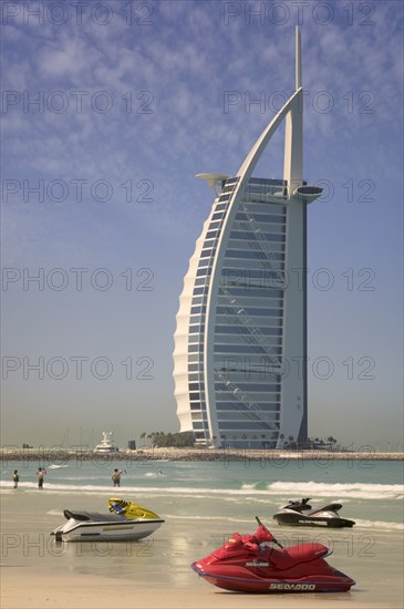 UAE , Dubai, Jet skis on Umm Suqeim Public Beach with The Burj Al Arab Hotel in the background.