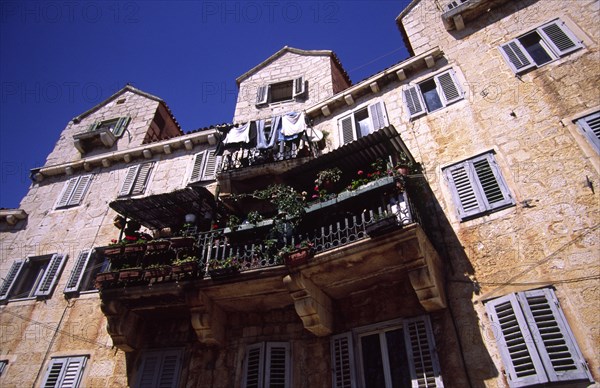 CROATIA, Dalamatia, Brac, Bol village house with balcony. The old village of Bol on the southern coast of the island of Brac retains much of its medieval feel