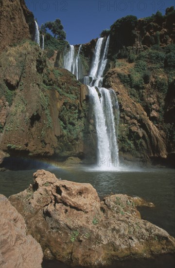 MOROCCO, Middle Atlas, Cascades d’Ouzoud, Waterfalls of the Olives.  Multiple falls cascading over rocks into natural pools.