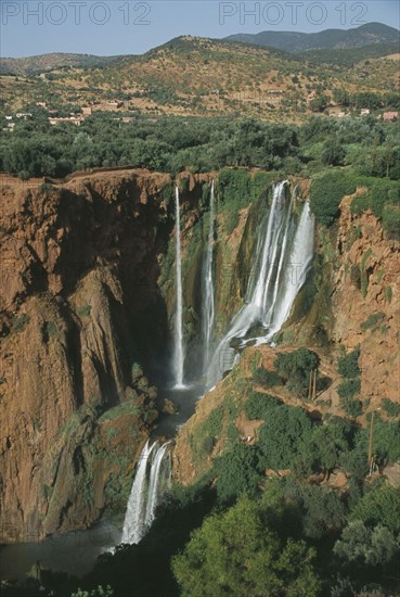MOROCCO, Middle Atlas, Cascades d’Ouzoud, Waterfalls of the Olives.  Multiple falls cascading over rocks into natural pools.