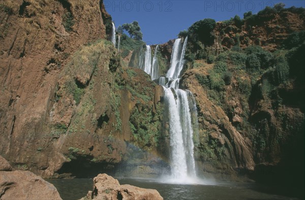 MOROCCO, Middle Atlas, Cascades d’Ouzoud, Waterfalls of the Olives.  Multiple falls cascading over rocks into natural pools.