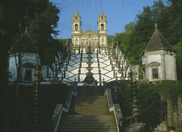PORTUGAL, Minho, Bom Jesus do Monte, Church east of Braga with baroque stairway with white painted walls lined with statues representing an upward spiritual journey