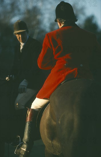 SPORT, Equestrian, Foxhunting, Riders on horseback with male rider wearing traditional red coat also known as hunting pink.