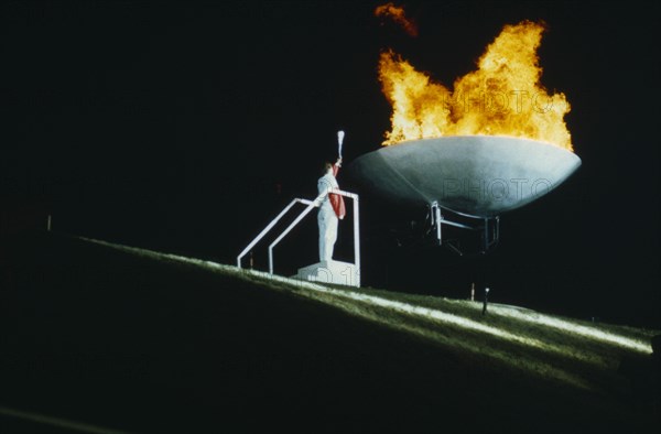 20069100 SPORT Athletics Opening Ceremony Helen Sharman lighting flame at World Student Games in Sheffield.