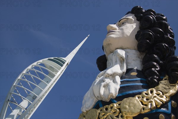 ENGLAND, Hampshire, Portsmouth, The Spinnaker Tower the tallest public viewing platforn in the UK at 170 metres on Gunwharf Quay with old ships bowspit figurehead in the foreground