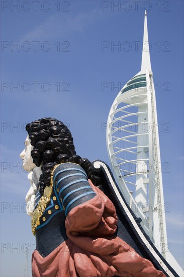 ENGLAND, Hampshire, Portsmouth, The Spinnaker Tower the tallest public viewing platforn in the UK at 170 metres on Gunwharf Quay with old ships bowsprit figurehead in the foreground