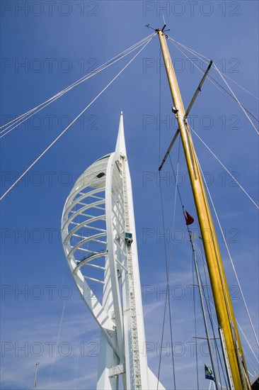 ENGLAND, Hampshire, Portsmouth, The Spinnaker Tower the tallest public viewing platforn in the UK at 170 metres on Gunwharf Quay with a yachts mast in the foreground