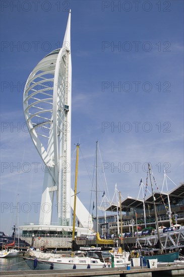 ENGLAND, Hampshire, Portsmouth, The Spinnaker Tower the tallest public viewing platforn in the UK at 170 metres on Gunwharf Quay with moorings in the foreground