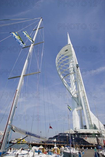 ENGLAND, Hampshire, Portsmouth, The Spinnaker Tower the tallest public viewing platforn in the UK at 170 metres on Gunwharf Quay with moorings in the foreground