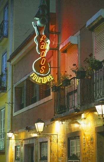 PORTUGAL, Lisbon, Illuminated neon sign in the Bairro Alto advertising Fado a musical genre especially popular in Lisbon.