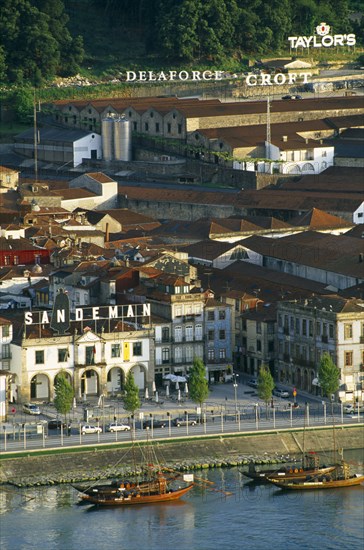 PORTUGAL, Porto, Oporto, "Vila Nova de Gaia port lodges or armazens of Croft, Delaforce and Sandeman beside the River Douro."