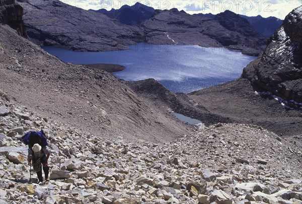 COLOMBIA, Cordillera , Boyaca, "The climb up to Boqueron Bellavista, looking down at a hiker and lagoon, Sierra Nevada de Cocuy."