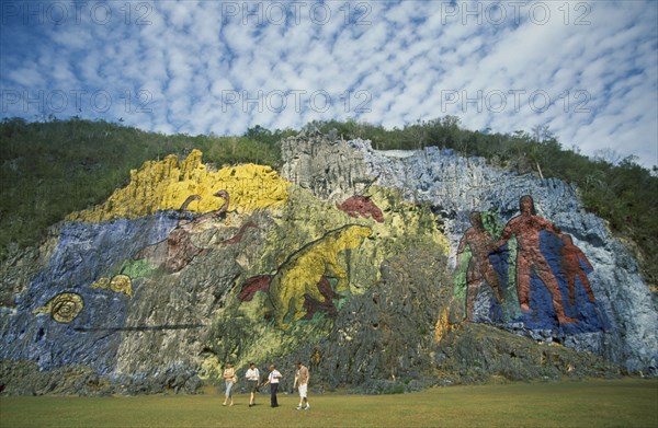 CUBA, Vinales, Mural de la Prehistoria.  Painting by Leovigildo Gonzales depicting evolution from amonites to homo sapiens.