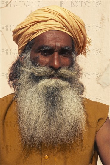 INDIA, Rajasthan, Jaisalmer, "Indian guru, with long beard and yellow head-dress."