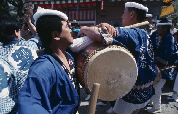 JAPAN, Honshu, Chiba, Choshi.  Playing Taiko Japanese drums in local festival.