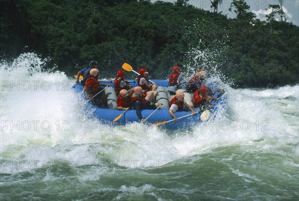 UGANDA, Jinja, Bujugali Falls. White water rafting near the source of the Nile.
