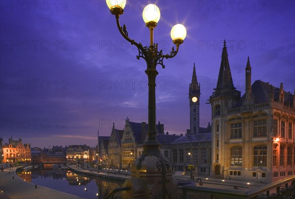 BELGIUM, East Flanders, Ghent, "View at night of the medieval core of the city over the Leie River from St Michielsbrug, St Michiels Bridge."