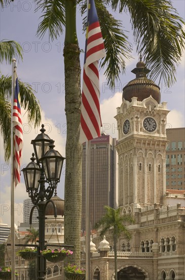 MALAYSIA, Peninsular, Kuala Lumpur, "The Sultan Abdul Samad Building with palm tree, flag and lamp post in the foreground. "