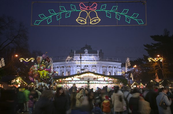 AUSTRIA, Lower Austria, Vienna, The Rathaus Christmas Market with The Burgtheater in the background.