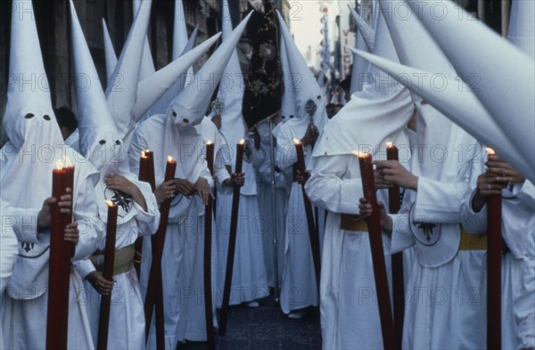 SPAIN, Andalucia, Seville, Semana Santa Holy Week penitents.