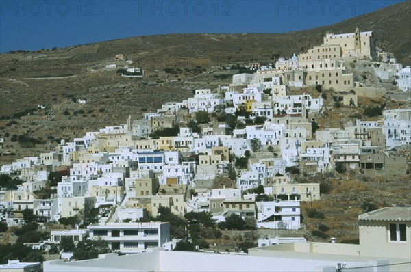 GREECE, Cyclades Islands, Syros, Ermoupolis. The Ano Sypros Catholic quater with mountains behind.