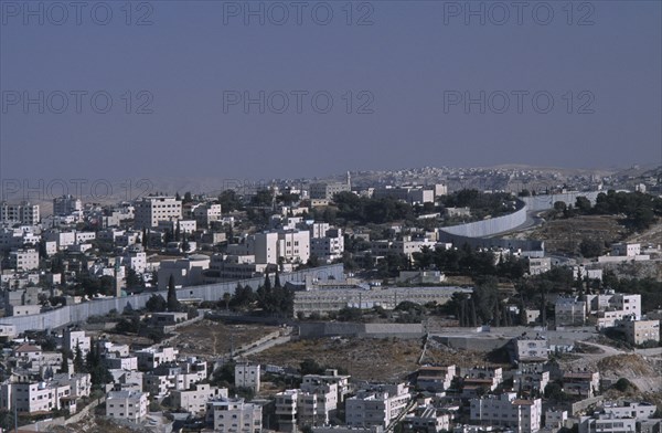 ISRAEL, East, Jerusalem, Elevated view over city architecture and The Security Fence which divides Israel from the West Bank