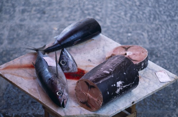 ITALY, Sicily, Catania, La Pescheria di Sant Agata. Fish market with a selection of fish on a cutting board