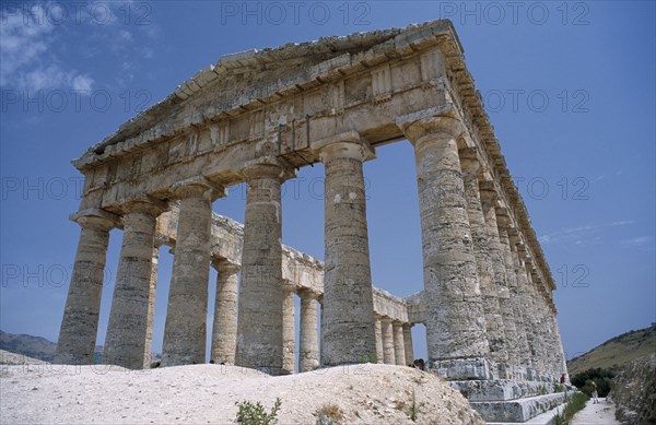 ITALY, Sicily, Trapani, Segesta. Doric Temple. Ruins of the ancient city with view of hexastyle colonnaded structure