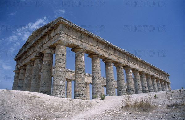 ITALY, Sicily, Trapani, Segesta. Doric Temple. Ruins of the ancient city with view of hexastyle colonnaded structure