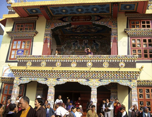 NEPAL, Kathmandu,  A highly decorated temple outside Swayambhunath Stupa busy because its the day of the full moon an important day for Buddhists