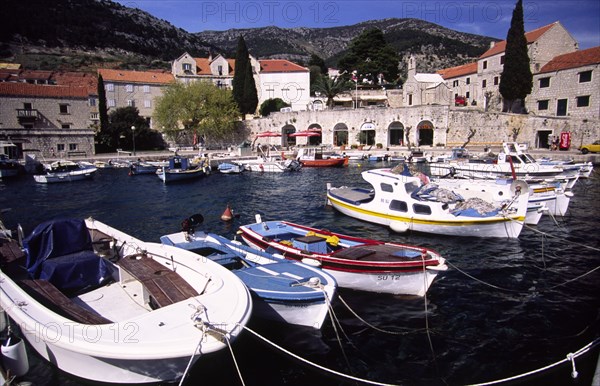 CROATIA, Dalmatia, Brac, "Bol marina nestled beneath Vidova Gora mountain ridge on the south side of the island, the fishing village of Bol with its idyllic marina and golden, horn shaped beach is Brac's prime spot for tourism "