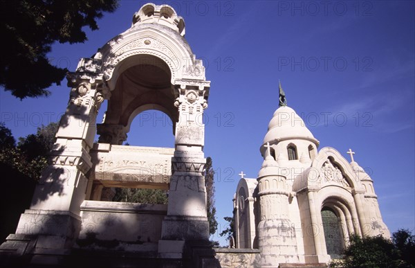 CROATIA, Dalmatia, Brac, "Supetar Petrinovic mausoleum. Croatian sculptor Toma Rosandic created this beautiful neo-Byzantine mausoleum for the Petrinovic family when the commission was turned down by his famous predecessor, Ivan Mestrovic. The mausoleum is one of many finely sculpted monuments which lie in the town cemetary, a short walk from the centre of the town of Supetar "