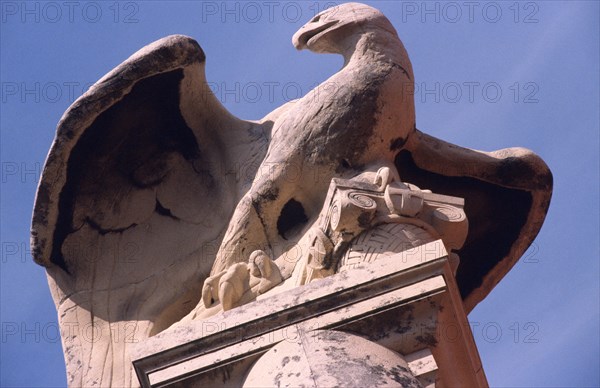 CROATIA, Dalmatia, Split, "Archeological museum/sculpture of Roman eagle. Flanking the main building of the museum are two giant pillars. Perched majestically atop the left hand column is a magnificent sculpture of a Roman eagle. The museum is home to an extensive array of Roman artefacts collected from nearby Salona, once the capital of Roman Dalmatia and from the city of Split itself.